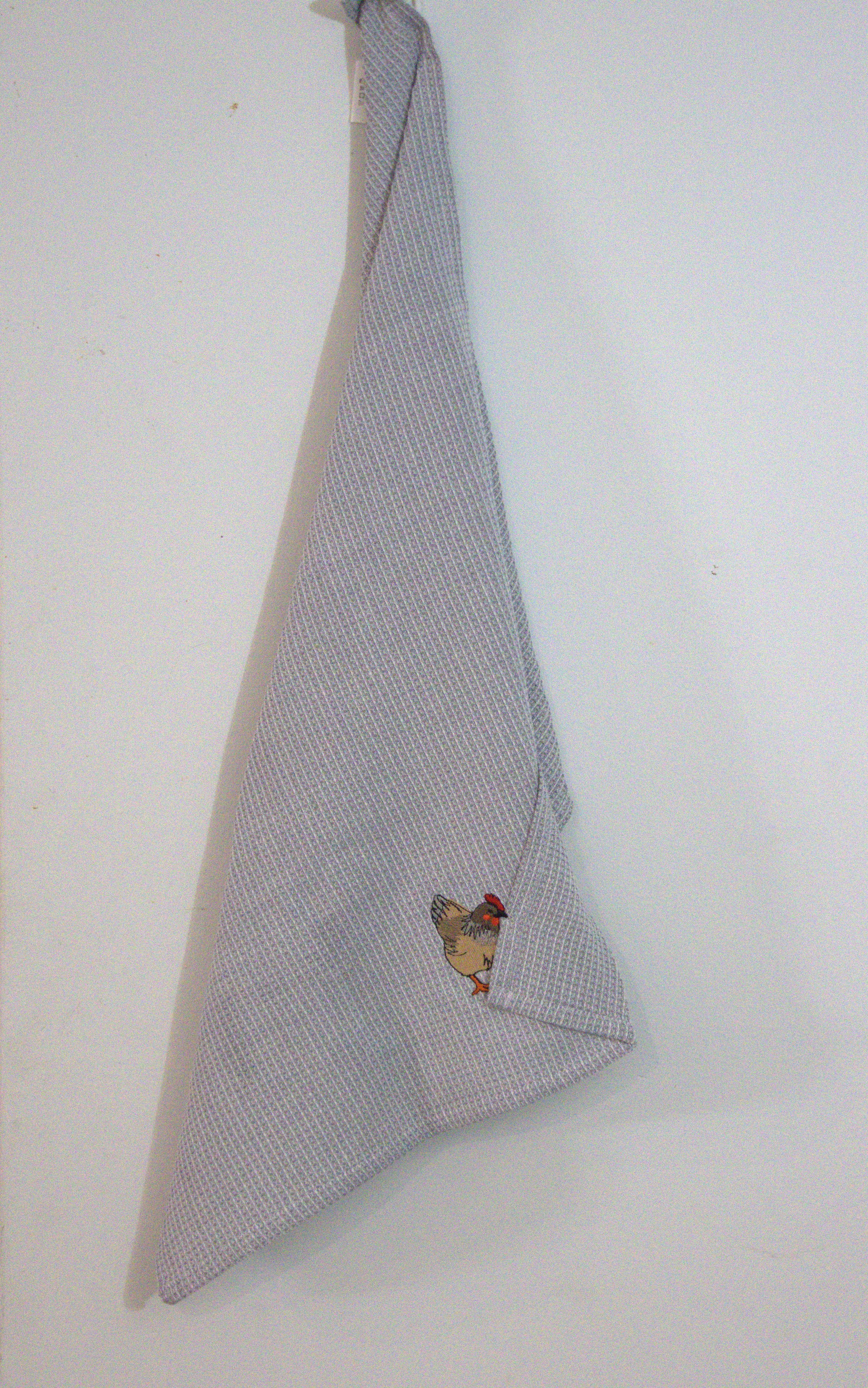 Embroidered tea towel with brown dachshund on grey check pattern