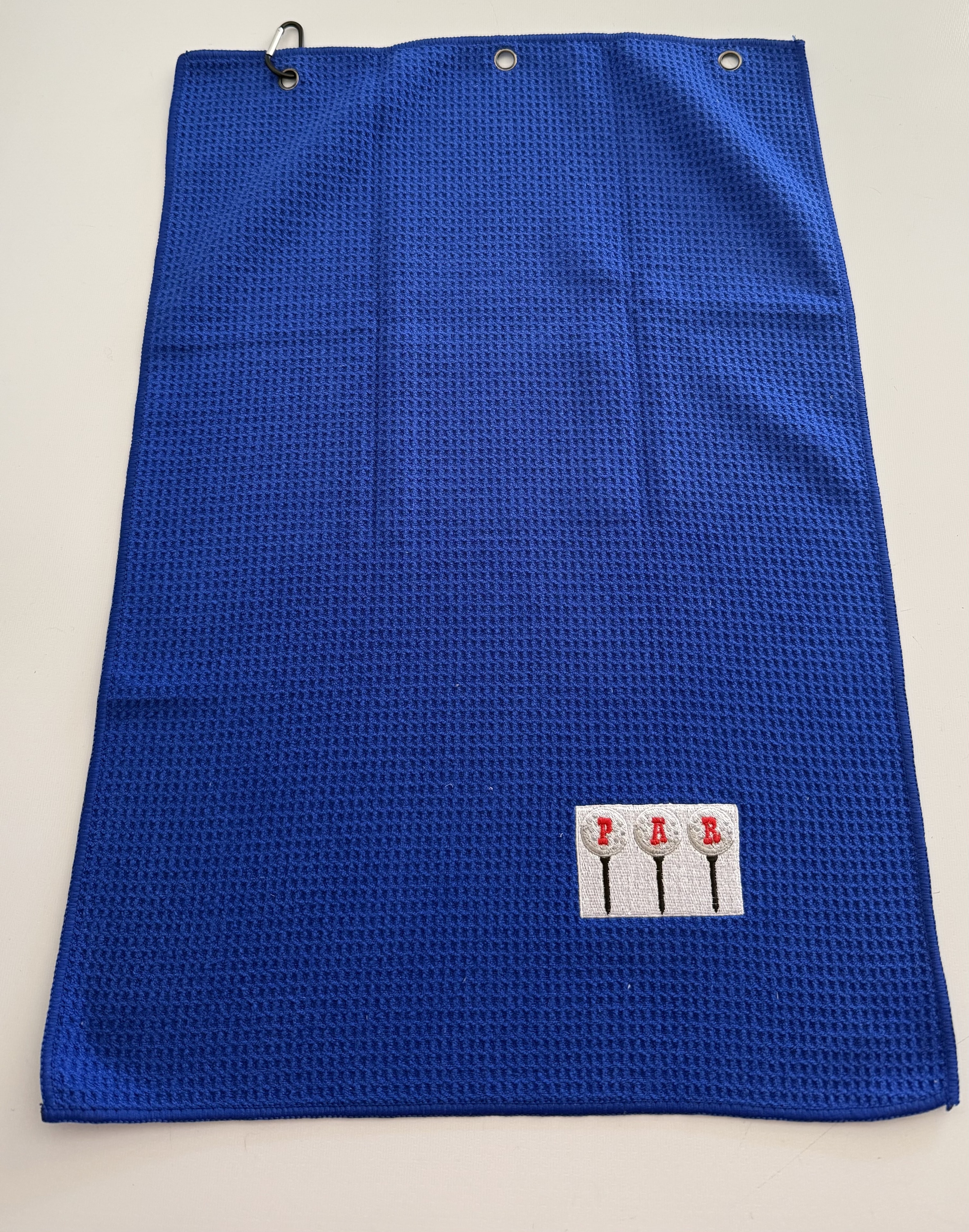 Royal blue embroidered PAR golf towel with carabiner clip